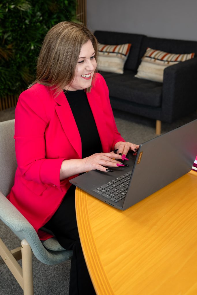 Ambitious founder sat at a table on a laptop taking part in a PR webinar series